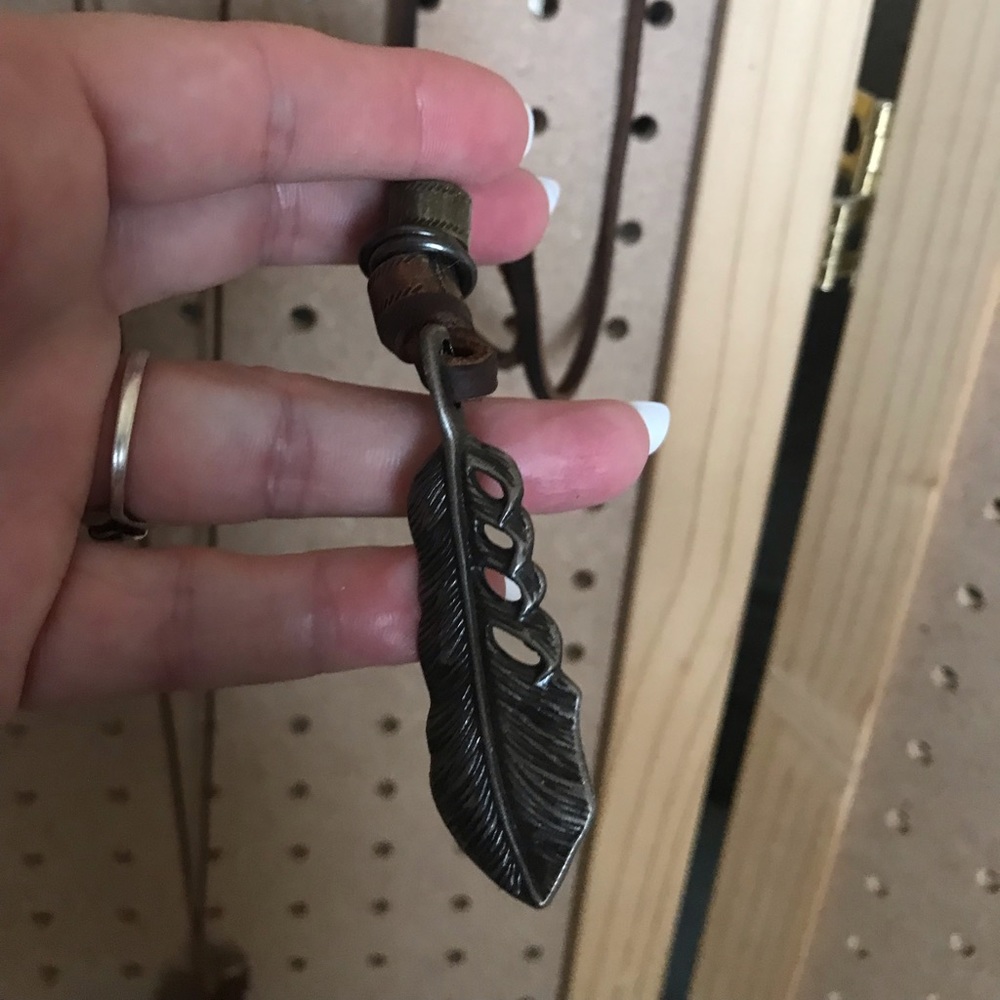 Dark brown with gunmetal feather & beading.